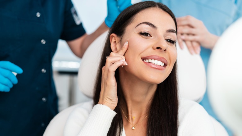 woman looking in mirror