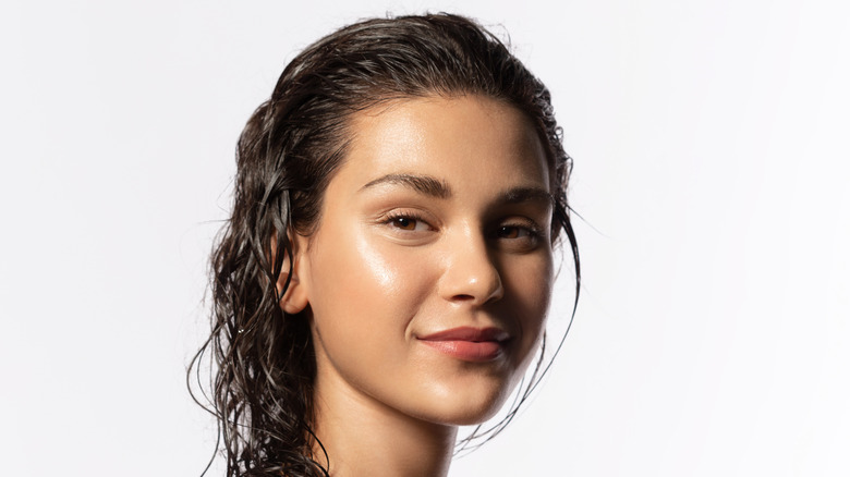 woman with bare face and damp hair