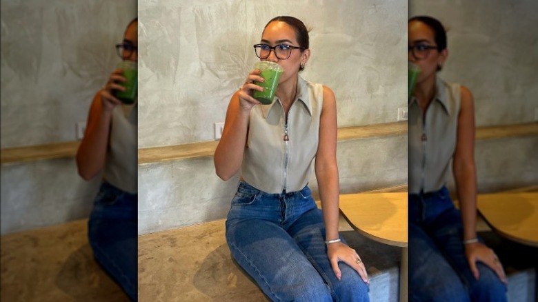 girl wearing vest and jeans