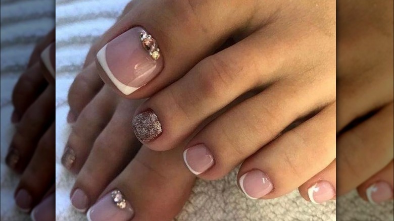 French pedicure with gold accents