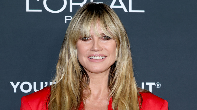 Heidi Klum smiles on the red carpet of a beauty event