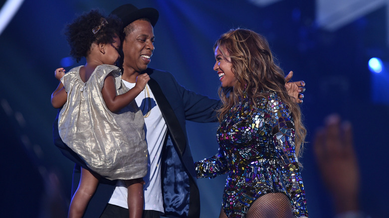 Beyoncé and Jay-Z on stage with Blue Ivy.