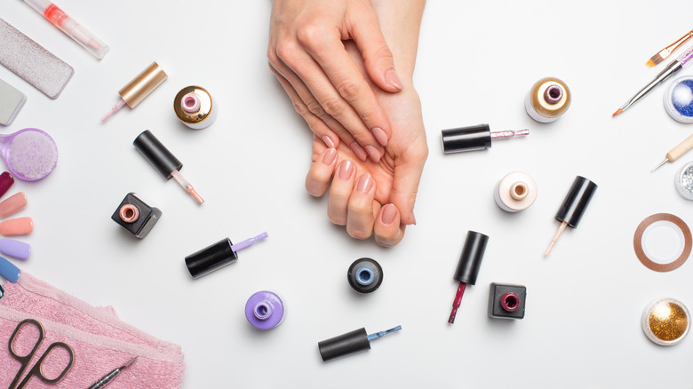 hands with polish surrounding