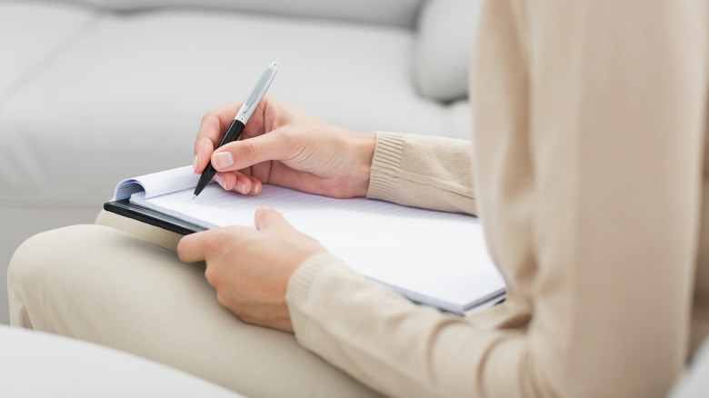 therapist taking notes