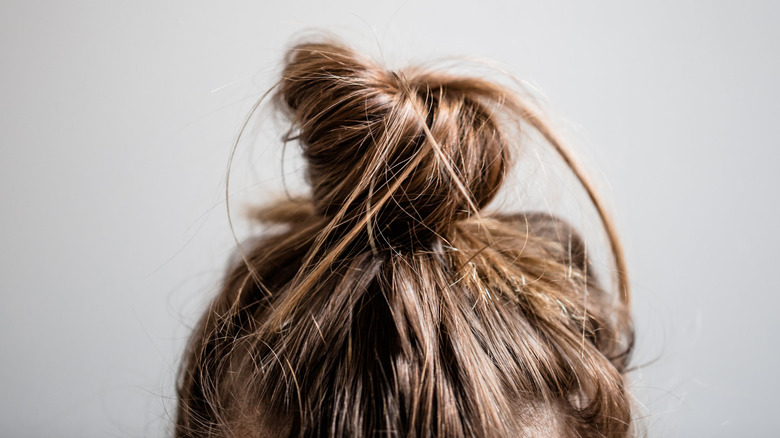 Hair in a messy bun