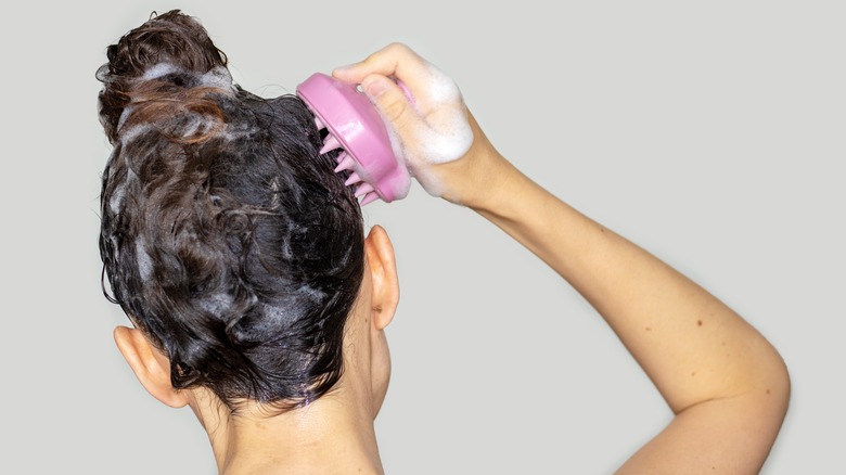 exfoliating with scalp brush