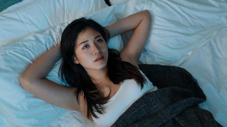 Woman laying awake with insomnia