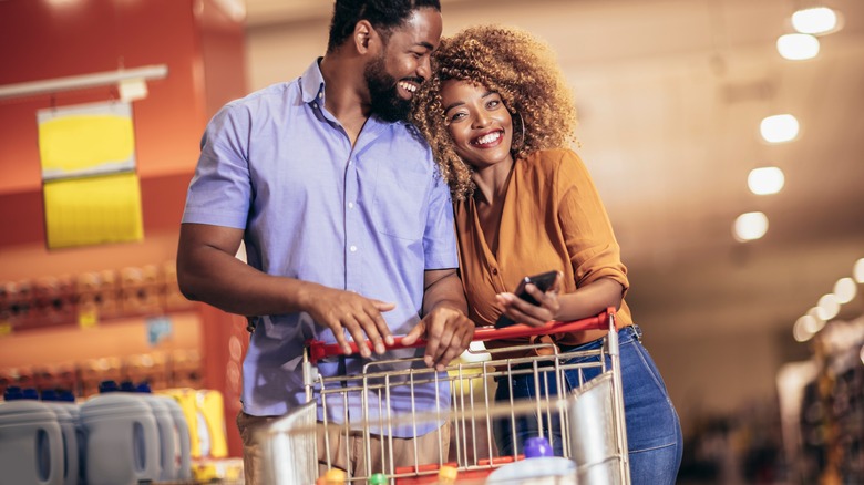 A couple grocery shopping