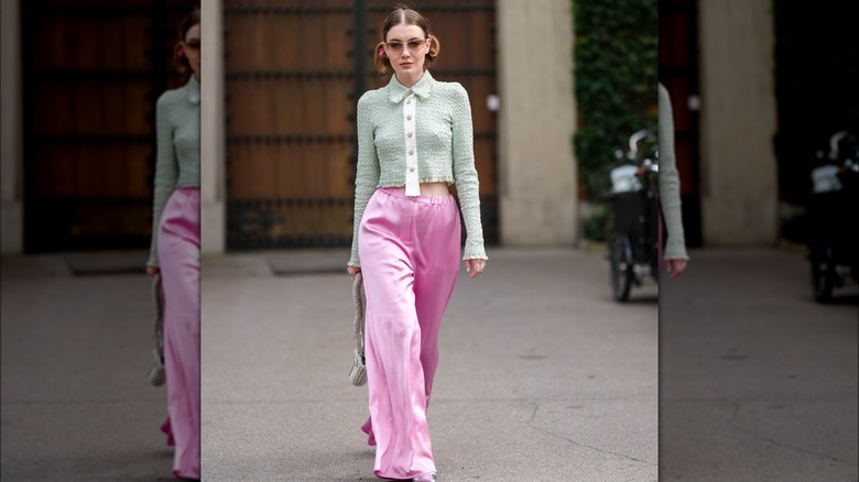 woman wearing pink silk pants