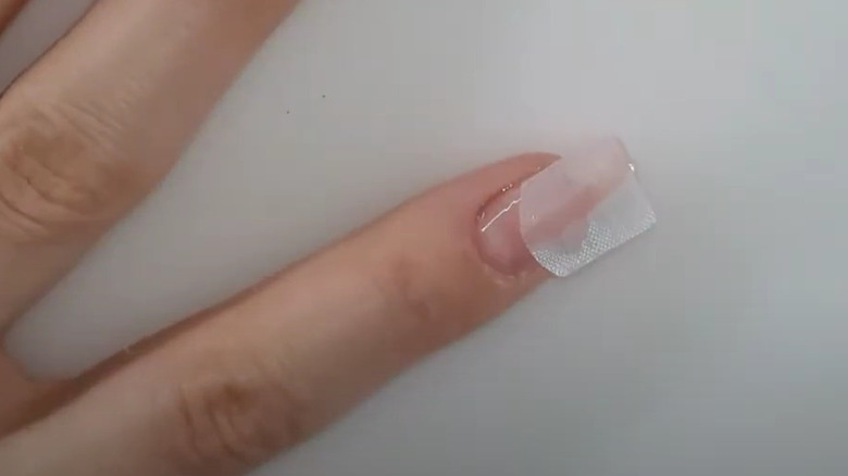 silk on top of nail 