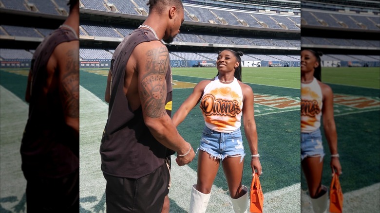 Simone Biles wearing a white graffiti shirt