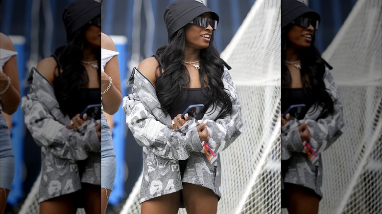 Simone Biles wearing a gray jacket at a Bears preseason game