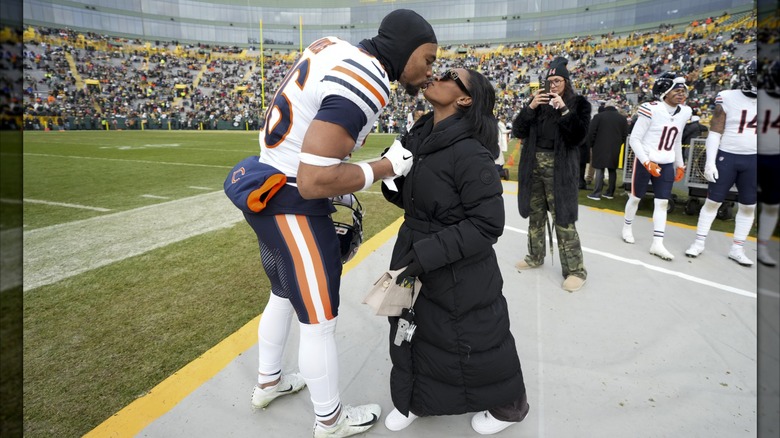 Simone Biles and Jonathan Owen on the field