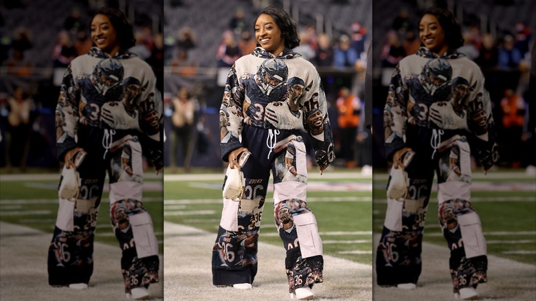 Simone Biles with a white purse