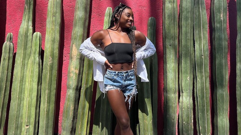 Simone Biles wearing denim shorts