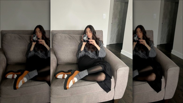 woman wearing outfit with black loafers