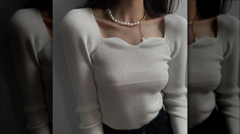 woman wearing outfit with pearls