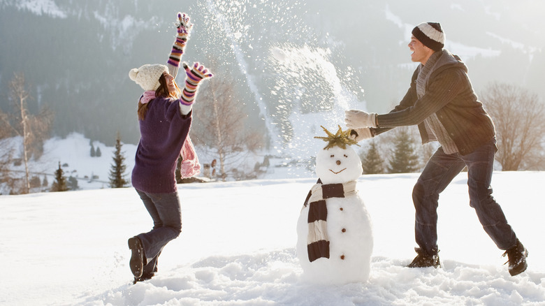 Couple playing in snow