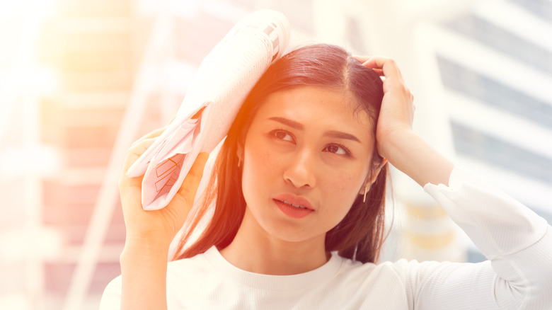 Person hiding from sun