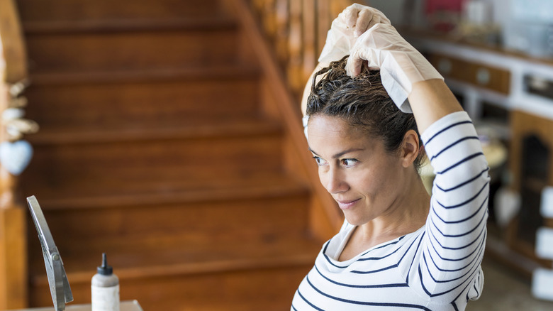 woman dyeing her own hair