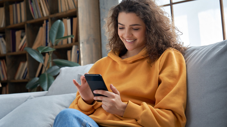 Woman scrolls dating app