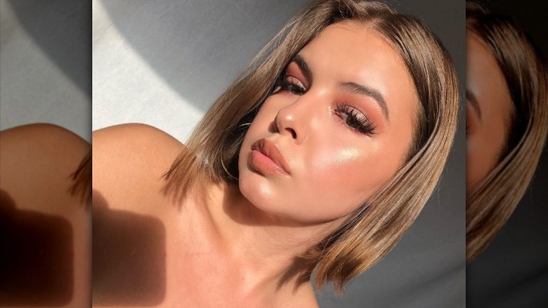 woman posing with siren skin makeup 