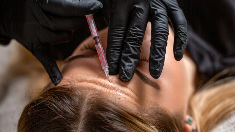 A woman getting botox.