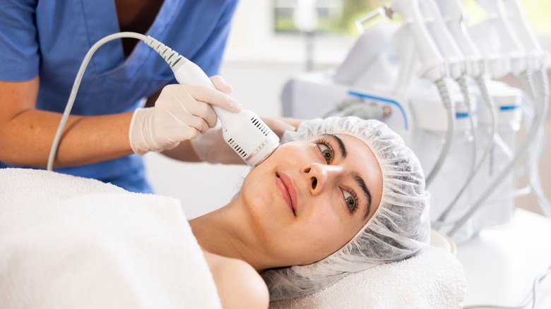 A woman getting a cryotherapy facial