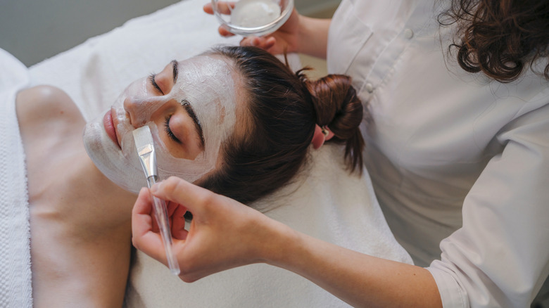 A woman getting a facial.