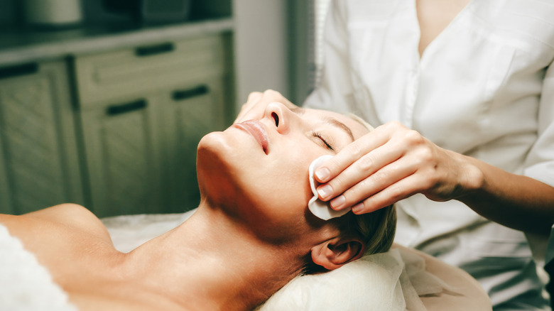 A woman getting a facial.