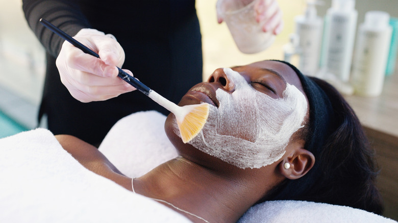 A woman getting a light chemical peel.