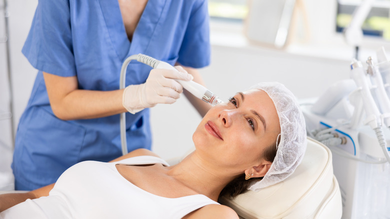 A woman getting an oxygen facial.