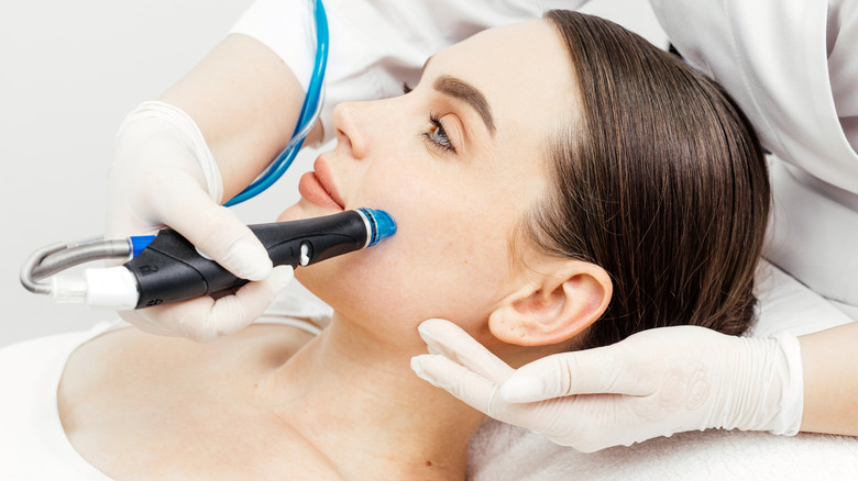 A woman getting a HydraFacial treatment.