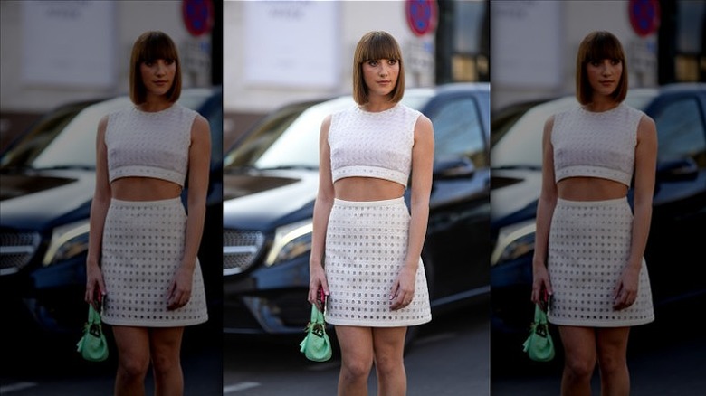 woman wearing white skirt suit