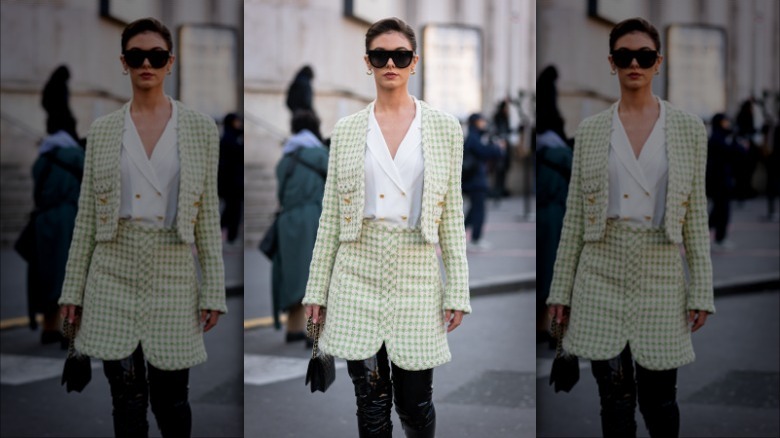 woman wearing green skirt suit