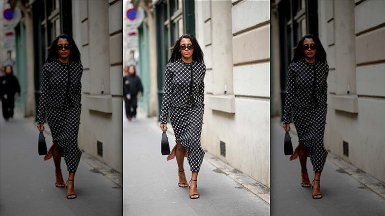 woman wearing printed skirt suit