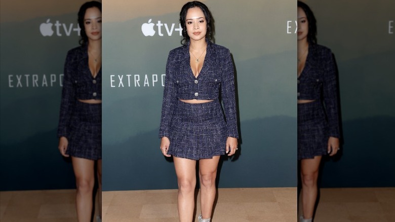 woman wearing tweed skirt suit