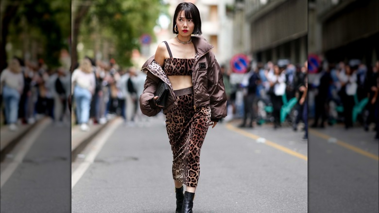 woman wearing leopard midi skirt
