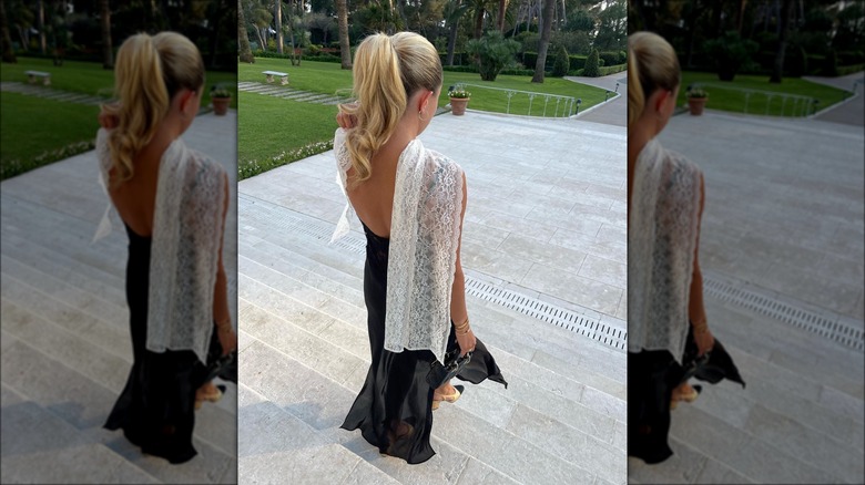 Woman wearing maxi slip dress with sling back shoes and white shawl