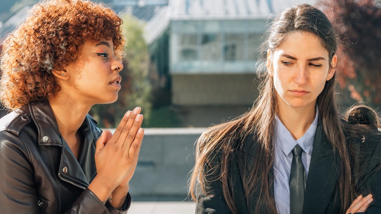 person apologizing to friend