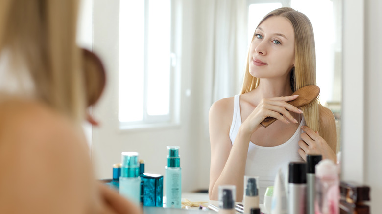 A woman brushing her hair