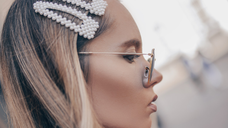 Woman uses big hair clips