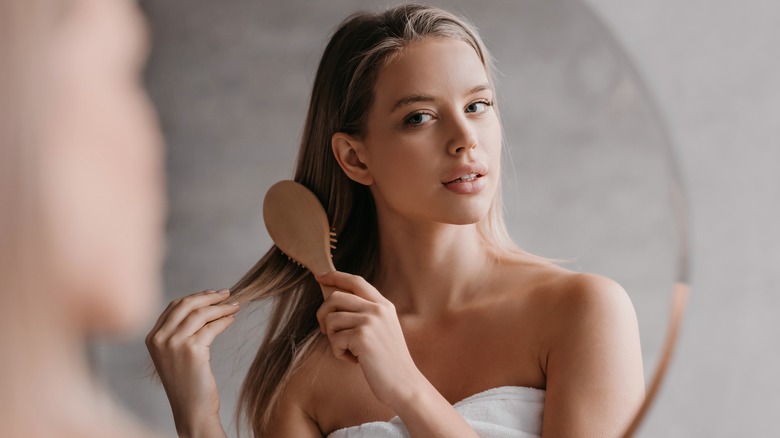 woman brushing her hair