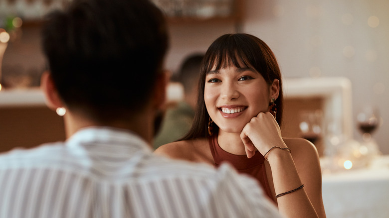 woman smiling at man 