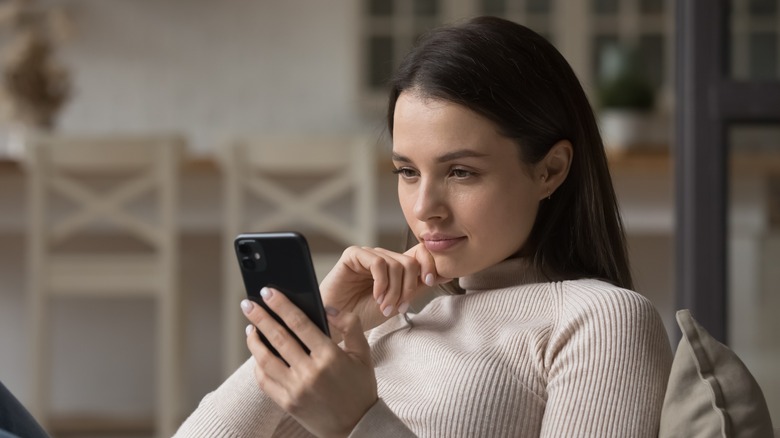 Woman looking at cell phone