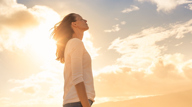 Woman looks relaxed outdoors