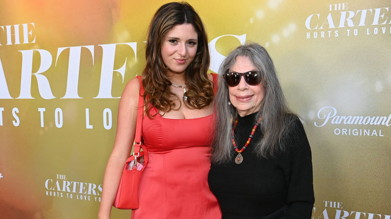 Jagger Blue wearing a red dress