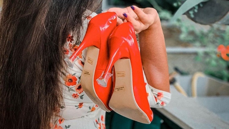 woman holding SoleMates product