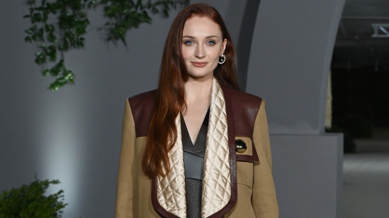 Sophie turner in tan jacket