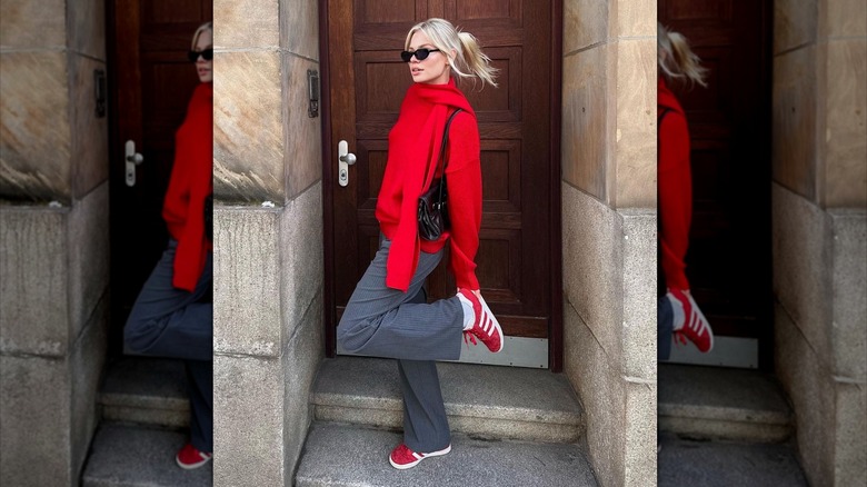 woman in monochromatic red sweater 